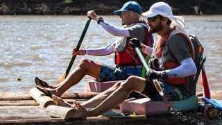 Paul and Simon paddling down the Amazon on their TV show Boundless!