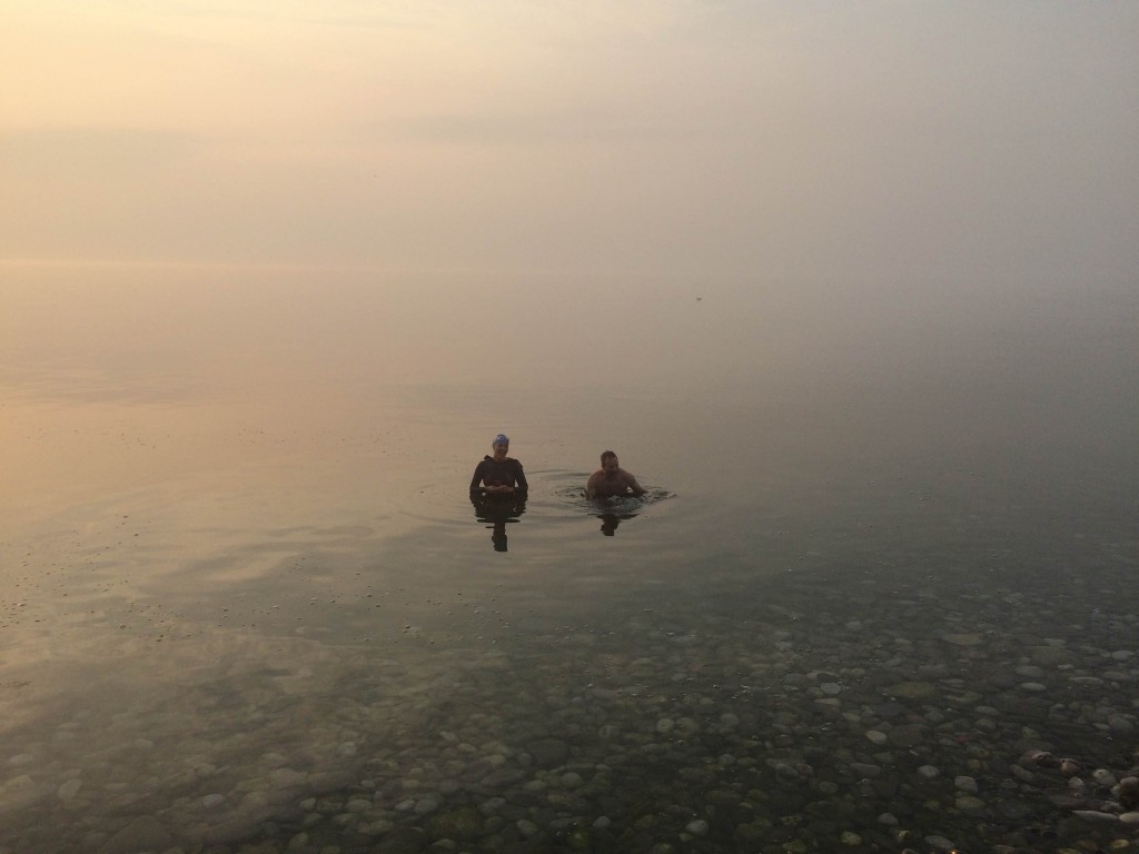 Fannie and Darren... finishing their sunrise swim... flat as pool water and crystal clear!